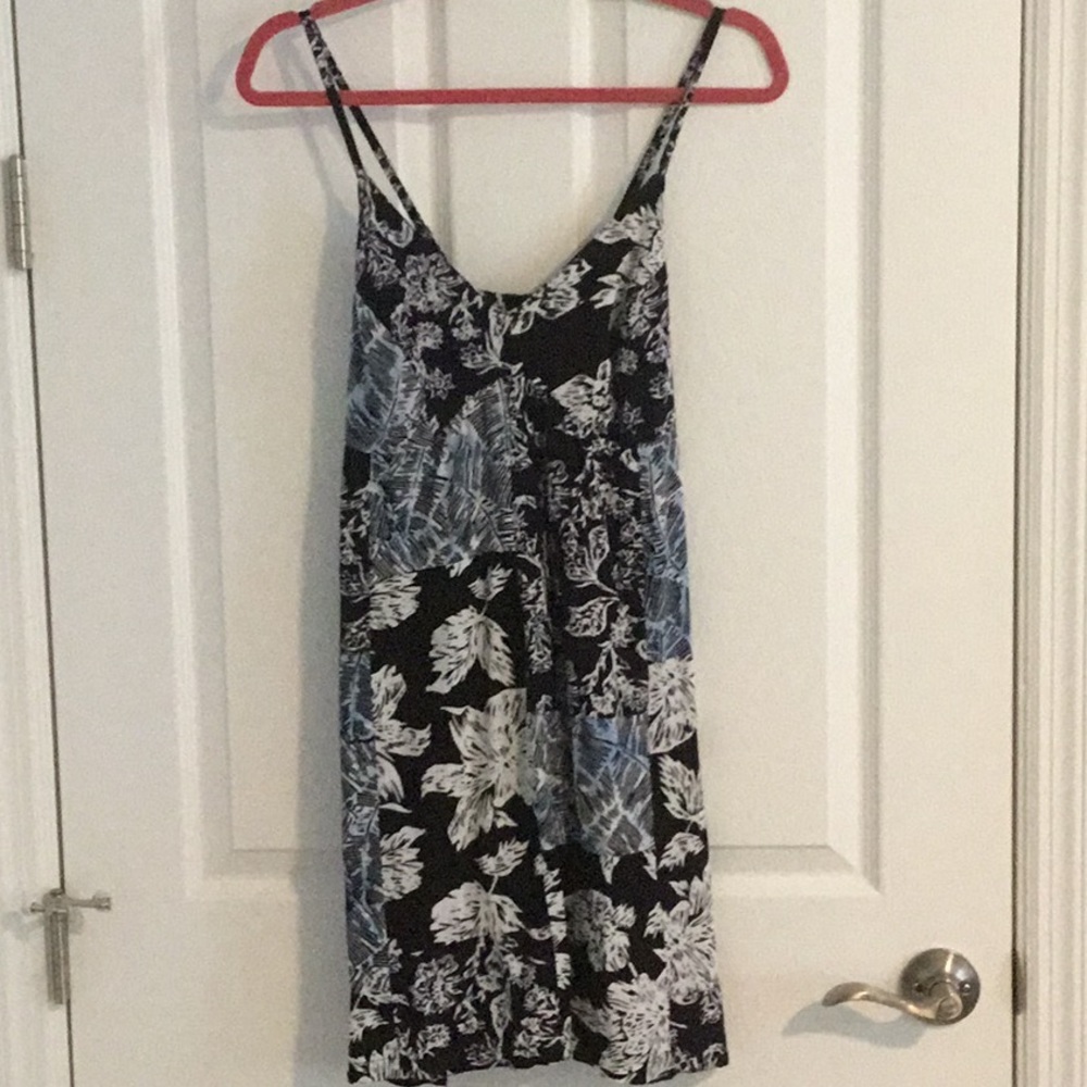 Sundress with adjustable straps and elastic in back.